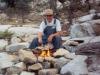 Charlie Cooking Fish Over the Fire - Photo by Matthew 