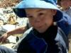 Elizabeth hooked Michael's hat with a rooster tail. 