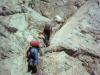 Climbing up a crack between the cliffs. 