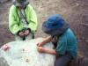 Playing Uno on a boulder table. 